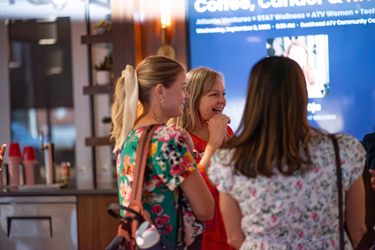 Attendees laughing together at the Coffee, Candor & Kristin Oja meetup